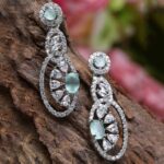 Gunmetal Toned Red American Diamond studded Oval Shaped...